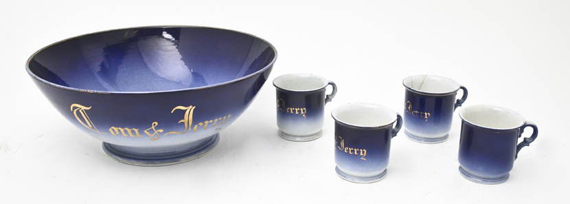 A French Ceramic Tom and Jerry Set, Luneville, Dia: A French Ceramic Tom and Jerry Set, Luneville, comprising a center bowl and four mugs. Diameter of bowl 13 1/4 inches.