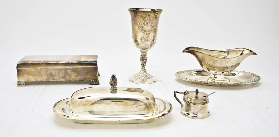 A Collection of Silverplate Table Articles, Height: A Collection of Silverplate Table Articles, comprising a water pitcher, a goblet, two trays, a gravy and others; 14 items total. Height of first 9 1/4 inches.