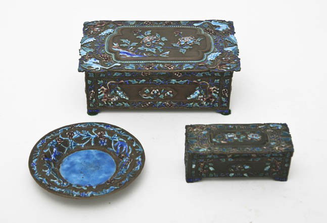 A Chinese Enameled and Silvered Metal Desk Set, Wi: A Chinese Enameled and Silvered Metal Desk Set, each with floral decoration comprising a humidor, an ash receiver and a stamp box. Width of widest 6 5/8 inches.