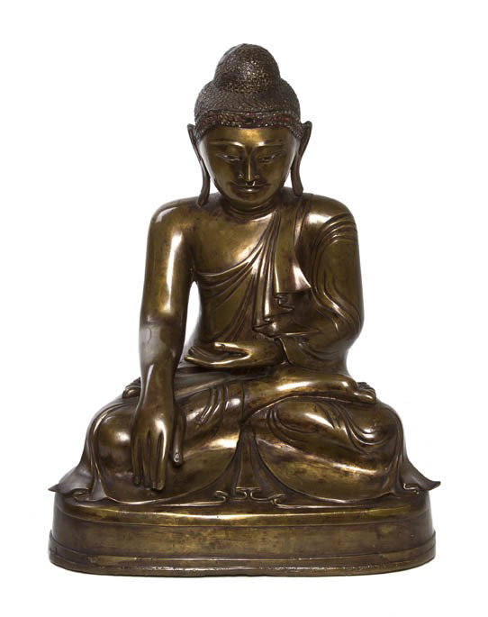 A Southeast Asian Buddha, Height 18 inches.: A Southeast Asian Buddha, seated in dhyanasana on an oval base, his right hand in bhumisparsa mudra, his left hand resting in his lap. Height 18 inches.