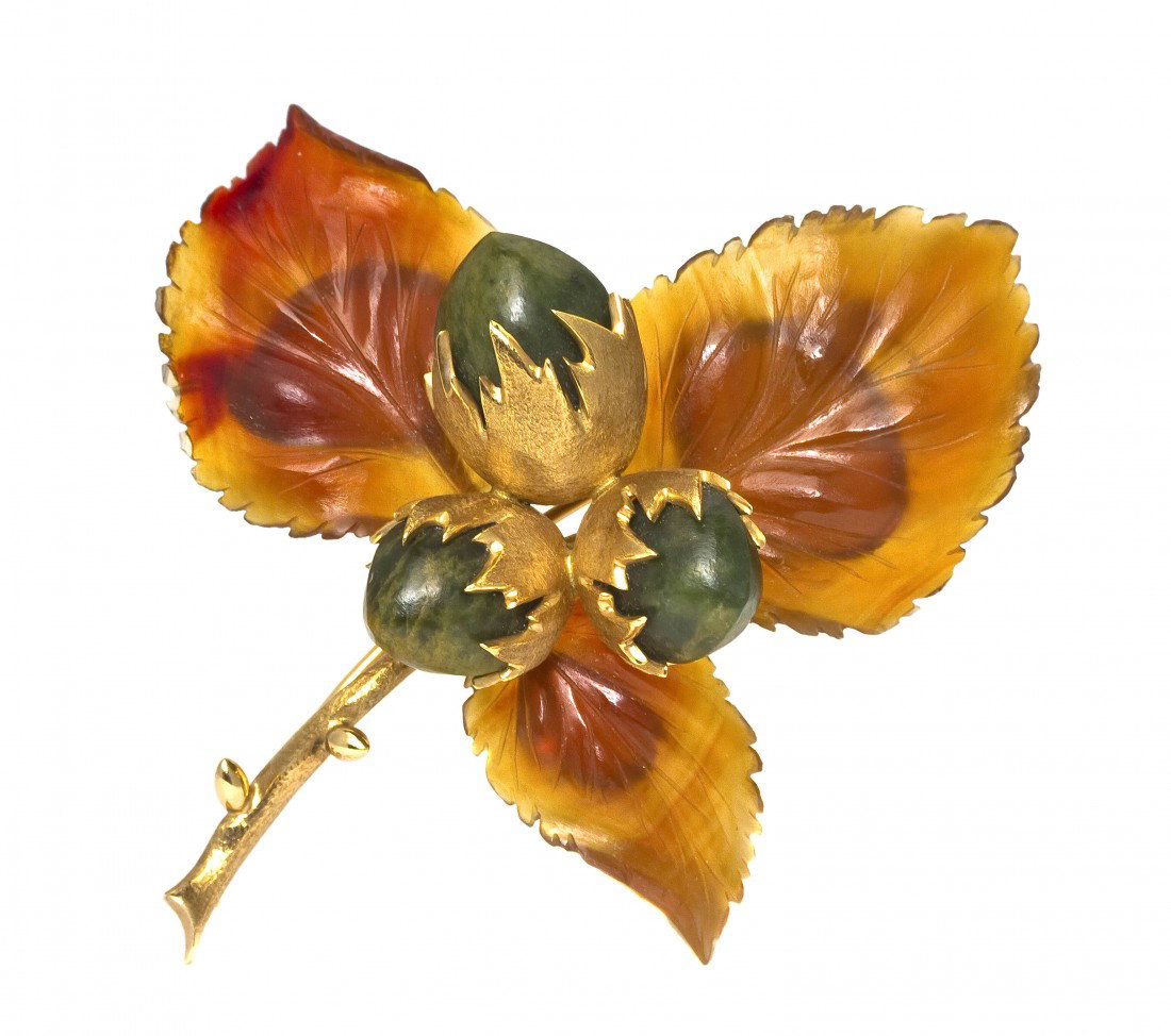A 14 Karat Yellow Gold, Carnelian and Hardstone Lea: A 14 Karat Yellow Gold, Carnelian and Hardstone Leaf Brooch, Austrian, in a realistic design consisting of three carved carnelian leaves surmounted by three carved green hardstone nuts enclosed within