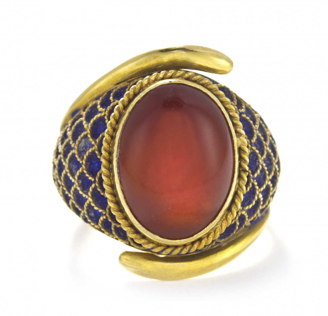 A 14 Karat Yellow Gold, Carnelian and Enamel Ring, : A 14 Karat Yellow Gold, Carnelian and Enamel Ring, containing one central collet set oval cabochon cut carnelian measuring approximately 14.00 x 10.50 mm in a bypass style wire surround, meshwork rope