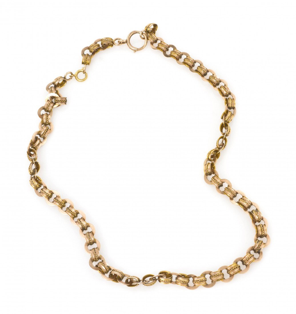 A 10 Karat Yellow Gold Fob Chain, 21.30 dwts.: A 10 Karat Yellow Gold Fob Chain, in a flat disk and fluted textured band link design. Length 22 inches. 21.30 dwts. Property from the Estate of Ken and Ellen Belford, Wheaton, Illinois
