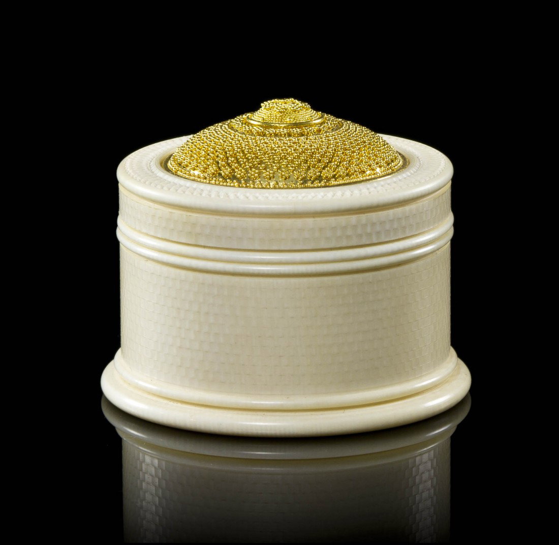 A 22 Karat Gold and Mastodon Ivory Box, Daniel Bru: A 22 Karat Gold and Mastodon Ivory Box, Daniel Brush, consisting of an ivory box with screw in top, intricate carved brick and interlocking circle texture accents on the sides, top and base, outer box