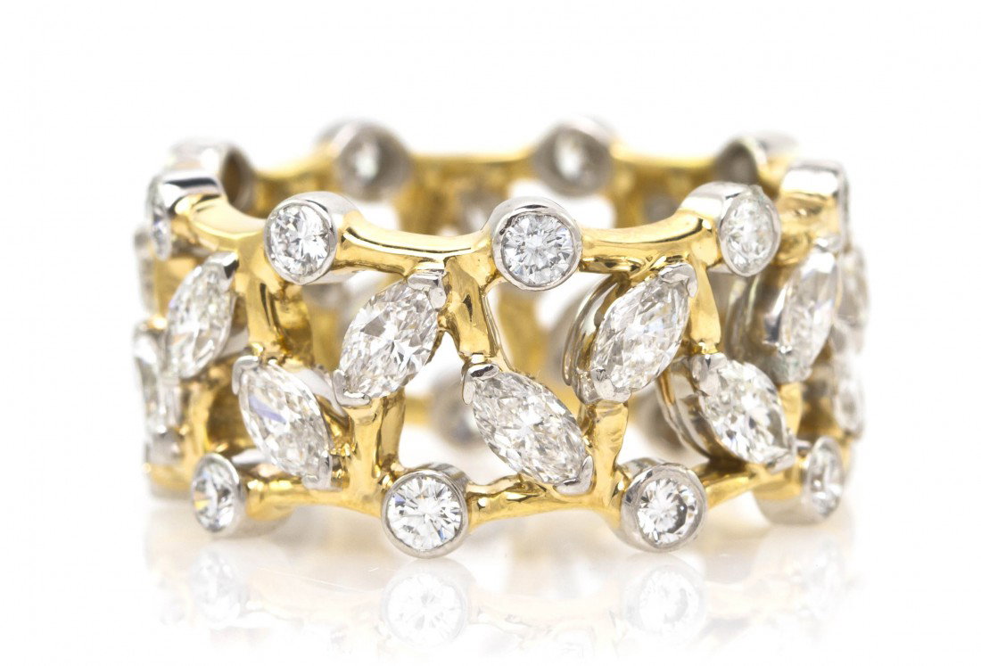 A Platinum, 18 Karat Yellow Gold and Diamond Ring,: A Platinum, 18 Karat Yellow Gold and Diamond Ring, Schlumberger Studios for Tiffany & Co., containing numerous round brilliant and marquise shape diamonds weighing approximately 3.70 carats total with