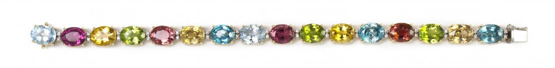 A 14 Karat Gold, Diamond and Multi Gem Bracelet, 2: A 14 Karat Gold, Diamond and Multi Gem Bracelet, containing 16 oval brilliant cut aquamarine, pink tourmaline, peridot, blue zircon, yellow zircon and yellow beryl measuring approximately 10.00 x 8.00
