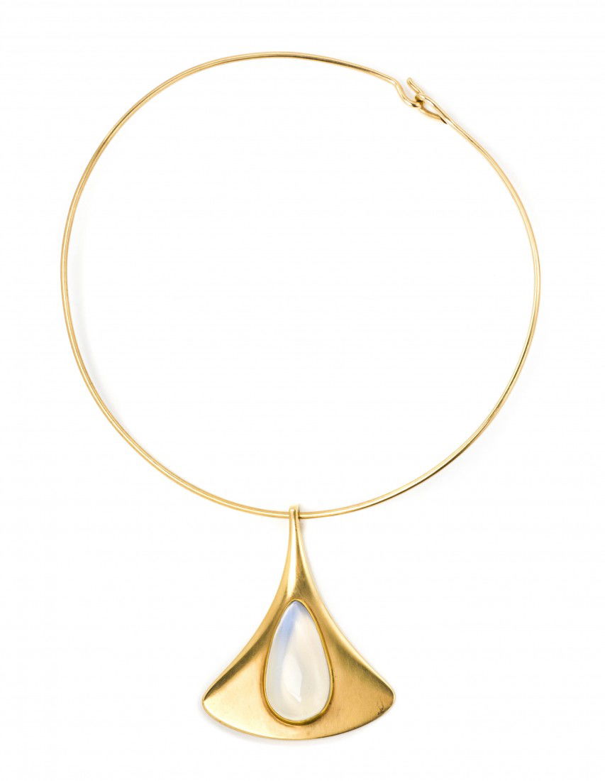 A 14 Karat Yellow Gold and Moonstone Necklace, Pot: A 14 Karat Yellow Gold and Moonstone Necklace, Potter Mellen, containing one pear shape cabochon cut moonstone measuring approximately 31.00 x 18.00 mm. 33.50 dwts.