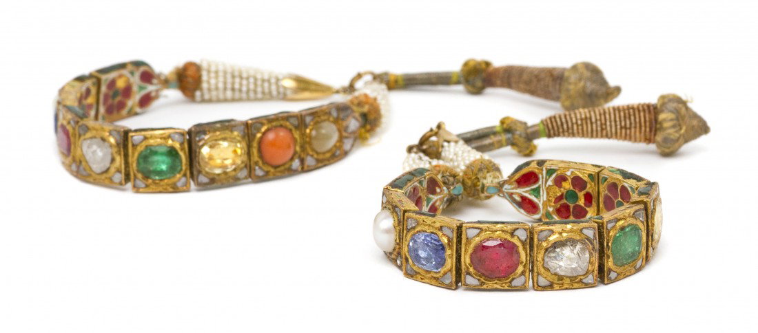 A Pair of 22 Karat Yellow Gold, Pearl, Coral, Diam: A Pair of 22 Karat Yellow Gold, Pearl, Coral, Diamond and Enamel Bracelets in a Mughal Style, containing oval brilliant and lasque cut stones, polychrome enamel detail on reverse side, braided seed pe
