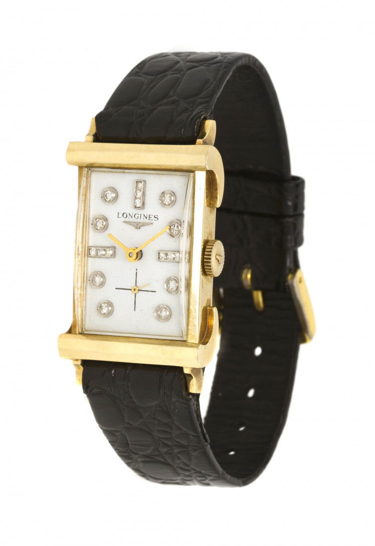 A 14 Karat Yellow Gold and Diamond Wristwatch, Lo: A 14 Karat Yellow Gold and Diamond Wristwatch, Longines, 32.00 x 22.50 mm case measurements, white porcelain dial, round single cut diamond numerals, gilt baton hands, subdial for seconds at 6 o'clock