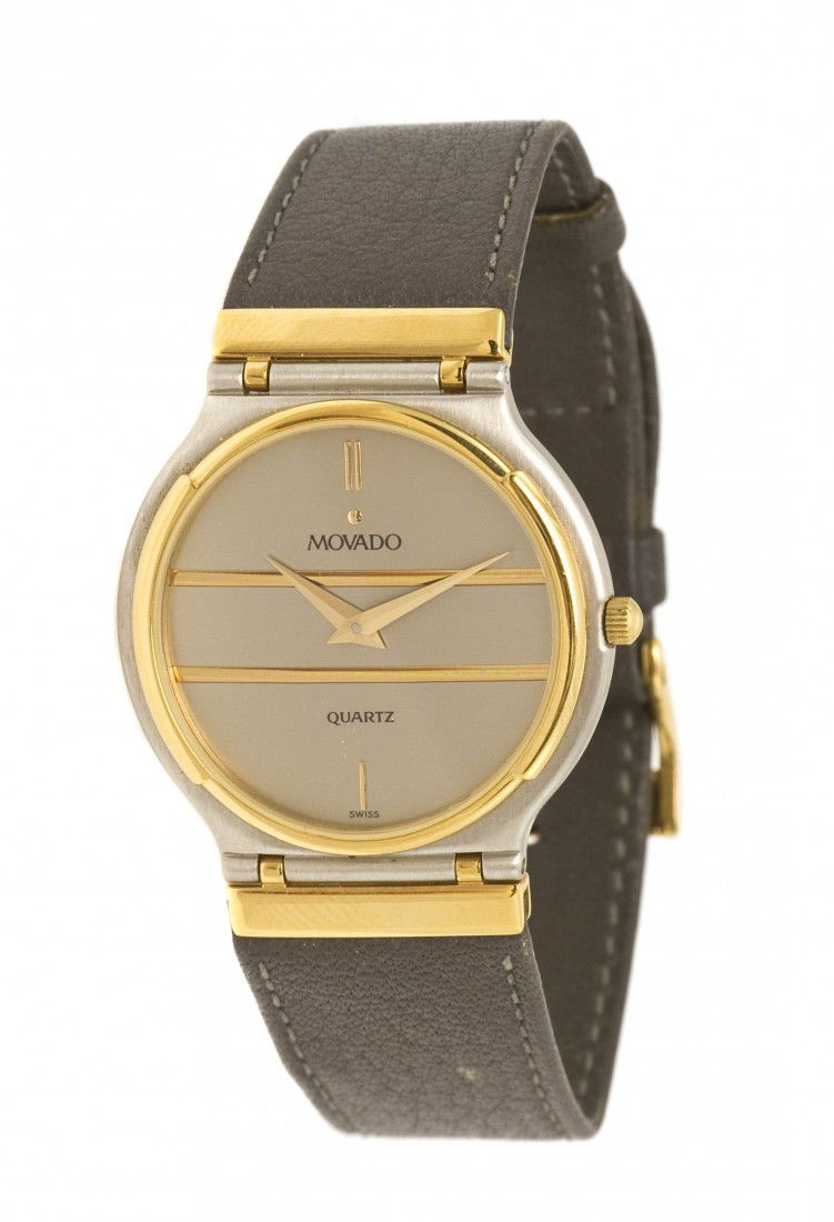 A Stainless Steel and Gold Tone Quartz Wristwatch: A Stainless Steel and Gold Tone Quartz Wristwatch, Movado, 32.00 mm case diameter, matte grey dial, applied gilt baton numerals and bar accents, gilt dauphine hands, gold tone bezel, brushed steel cas