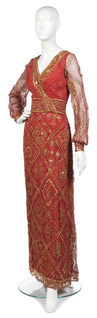 A Thea Porter Couture Red Silk Chiffon Evening Gown: A Thea Porter Couture Red Silk Chiffon Evening Gown, with all-over gold embroidery. Labeled: Thea Porter Couture.