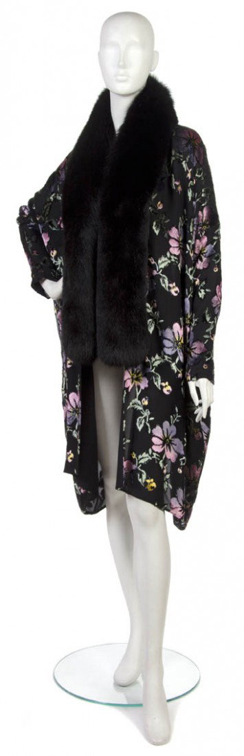 A Christian Dior Black Floral Cut Velvet Evening J: A Christian Dior Black Floral Cut Velvet Evening Jacket, with black fur trim. Labeled: Christian Dior.