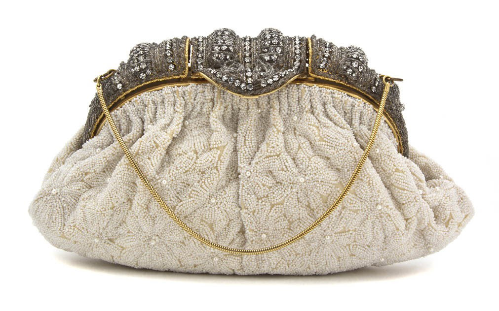 A Cream Beaded Evening Bag, 11 x 7 inches.: A Cream Beaded Evening Bag, with a rhinestone closure. Labeled: Delill. 11 x 7 inches. Property to Benefit the Big Shoulders Fund, Chicago, Illinois