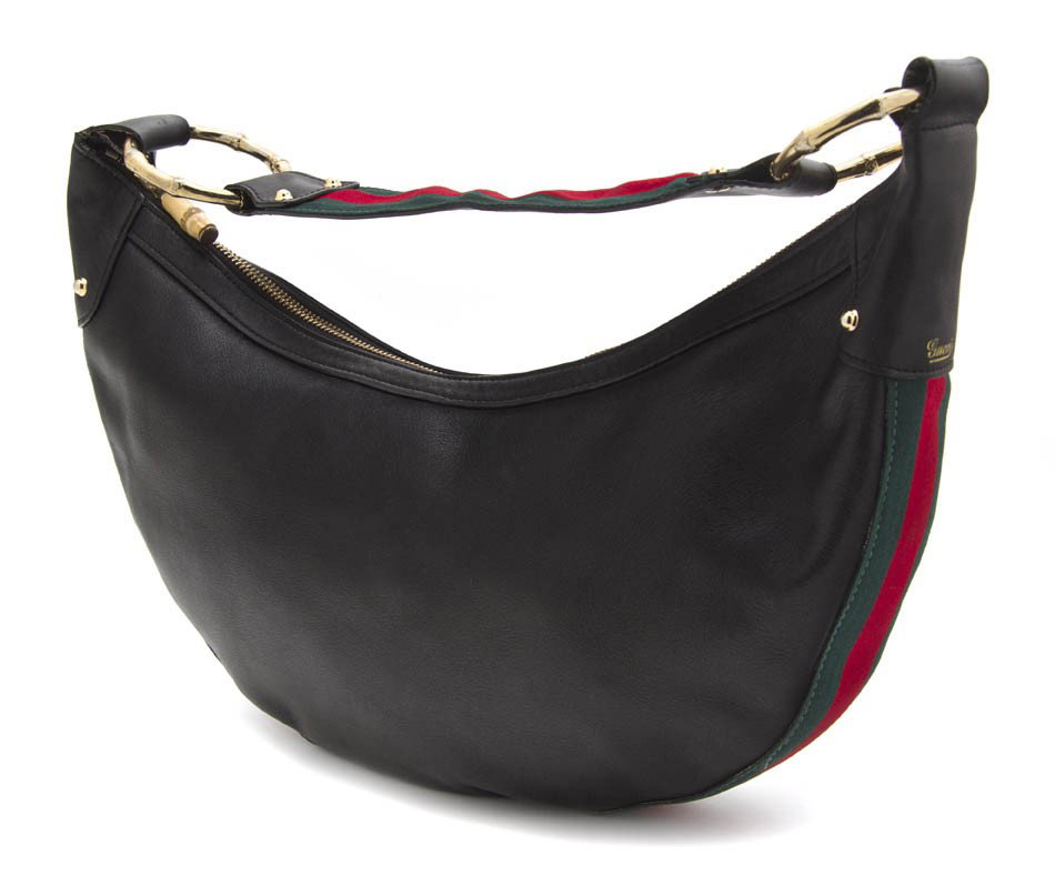 A Gucci Black Leather Bag, 15 x 8 inches.: A Gucci Black Leather Bag, with a red and green detail at base and strap. Stamped: Gucci. 15 x 8 inches. Property From the Collection of Bridget Lewis, Chicago, Illinois