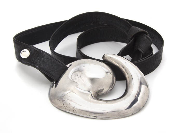 An Elsa Peretti Sterling Silver Swirl Buckle,: An Elsa Peretti Sterling Silver Swirl Buckle, together with a black leather belt. Stamped: E.