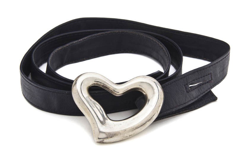 An Elsa Peretti for Tiffany & Co Sterling Silver H: An Elsa Peretti for Tiffany & Co Sterling Silver Heart Belt Buckle, with three interchangeable leather belts. Stamped: Peretti/Tiffany & Co/1975.
