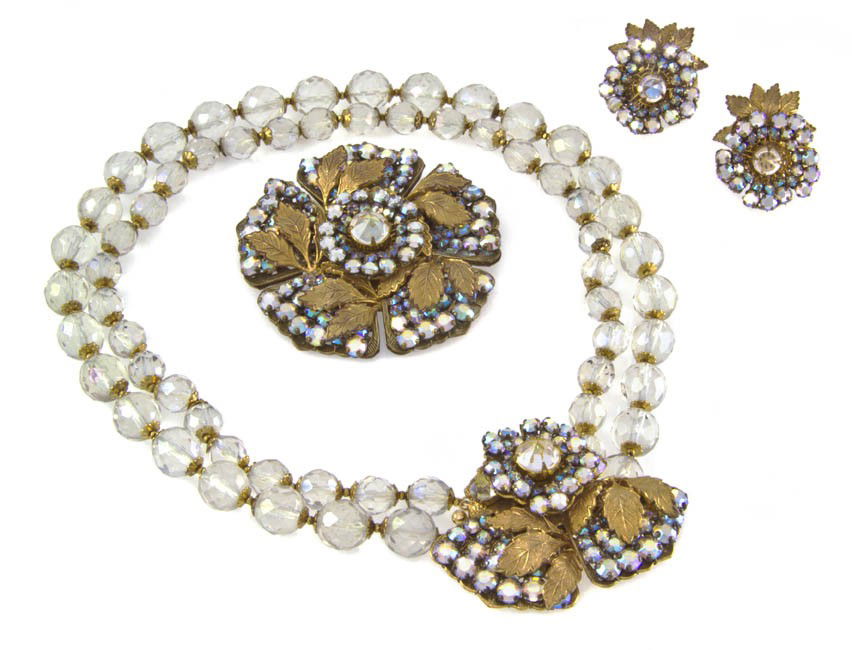 A Miriam Haskell Crystal and Leaf Suite,: A Miriam Haskell Crystal and Leaf Suite, comprised of a necklace, brooch and earclips. Stamped: Miriam Haskell.