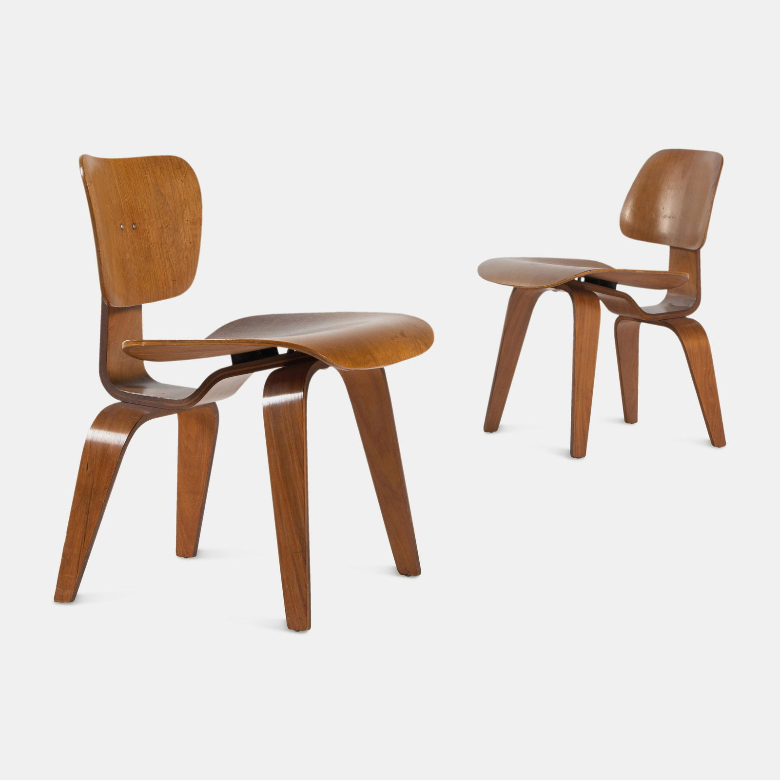 Charles and Ray Eames (American, 1907-1978 | American, 1912-1988) Pair of DCW Chairs, c. (1 of 4)