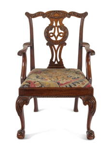 A George II Walnut Armchair: A George II Walnut Armchair Circa 1740 Height 37 1/2 x width 24 1/2 x depth 23 1/2 inches. This lot is located in Chicago. Provenance: The Swaythling Heirlooms, no. 473 Norman Adams Ltd., London, 2