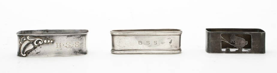 Three Sterling Silver Napkin Rings, Length of longe: Three Sterling Silver Napkin Rings, of various forms; approximate total weight 1.75 ozt. Length of longest 2 1/4 inches. Property from the Collection of Robert and David Smith, Michigan