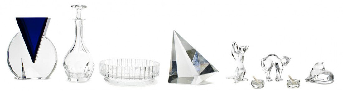 A Collection of Baccarat Glass Table Articles, Heig: A Collection of Baccarat Glass Table Articles, comprising three glass cat figures, a bowl and a decanter, together with a glass vase having a blue glass insert, a pair of salt cellars and a glass scul
