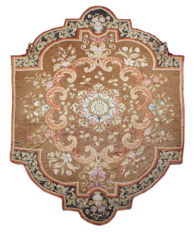 A French Aubusson Fragmentary Carpet, 12 feet 10 i: A French Aubusson Fragmentary Carpet, 19th century, having a center medallion with a floral spray on a brown field set within a conforming border with lobed corners. 12 feet 10 inches x 9 feet 7 inche