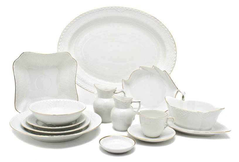 A Royal Copenhagen Porcelain Dinner Service for Tw: A Royal Copenhagen Porcelain Dinner Service for Twelve, comprising dinner plates, salad plates, bread plates, soup bowls, teacups, saucers, two creamers, a sugar, a leaf form dish, a vegetable dish an