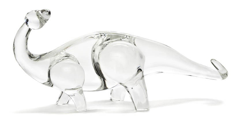 A Steuben Glass Model of a Dinosaur, Length 13 1/4: A Steuben Glass Model of a Dinosaur, in the form of a brontosaurus, signed Steuben. Length 13 1/4 inches.