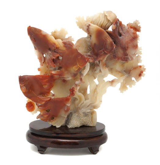 A Chinese Carved Soapstone Figure, Height 6 1/2 in: A Chinese Carved Soapstone Figure, depicting various marine life, raised on a hardwood stand. Height 6 1/2 inches. Property from the Collection of Michael Timmis, Naples, Florida