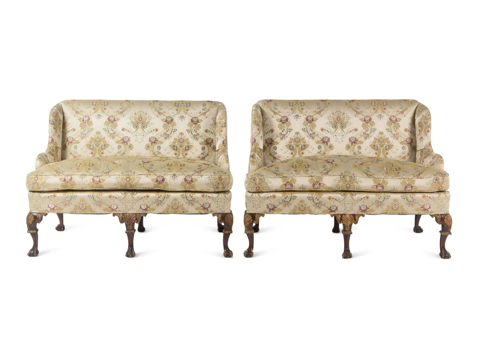 A Pair of George II Style Parcel-Gilt Walnut Settees: A Pair of George II Style Parcel-Gilt Walnut Settees 18th Century with Scalamandre upholstery. Height 41 x width 51 x depth 29 1/2 inches. ? This lot is located in Chicago.
