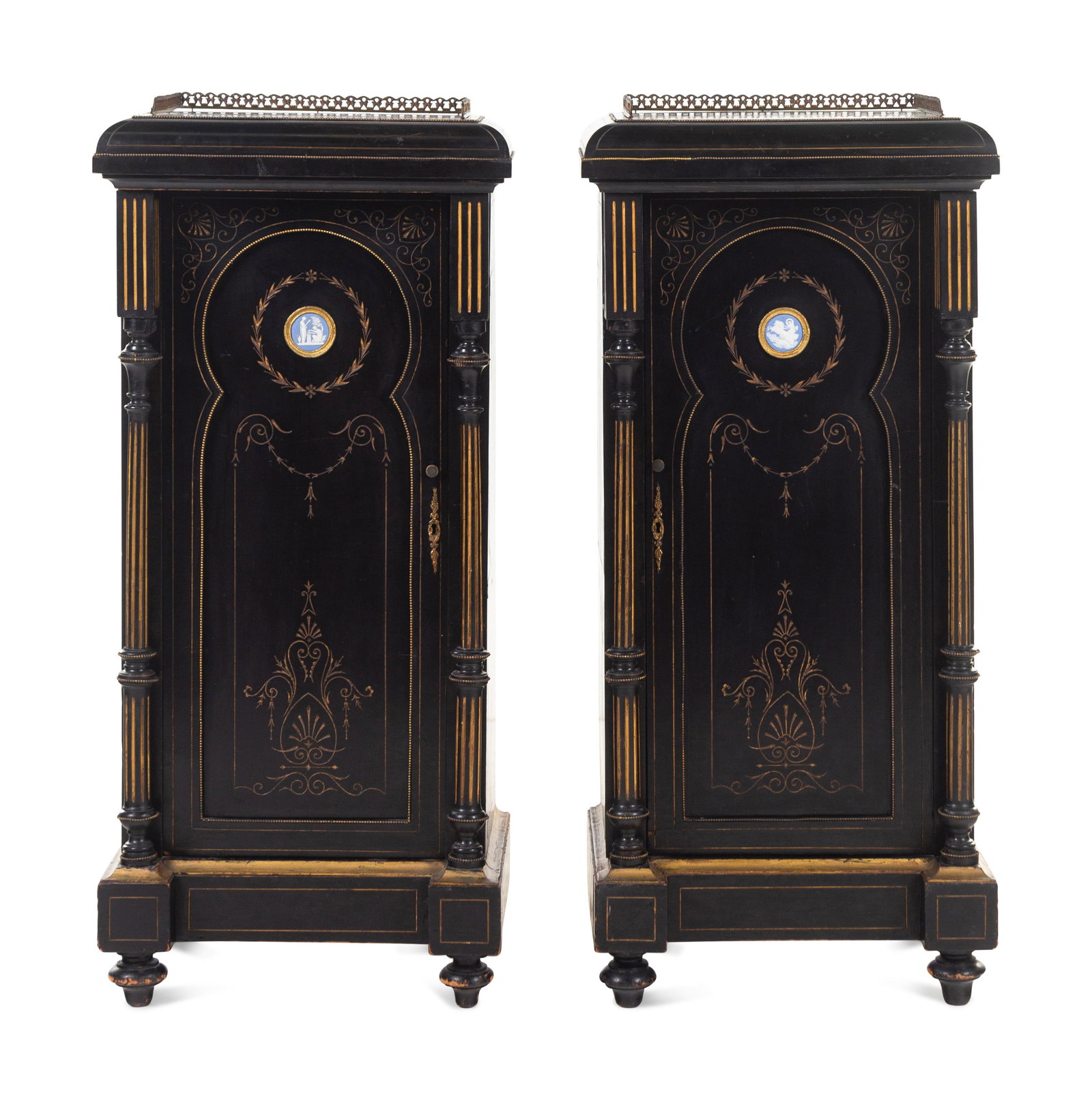 A Pair of English Aesthetic Jasperware Medallion-Mounted Ebonized and Parcel-Gilt Pedestal Cabinets: A Pair of English Aesthetic Jasperware Medallion-Mounted Ebonized and Parcel-Gilt Pedestal Cabinets Circa 1860-1870 Height 47 x width 21 x depth 17 inches. This lot is located in Chicago.