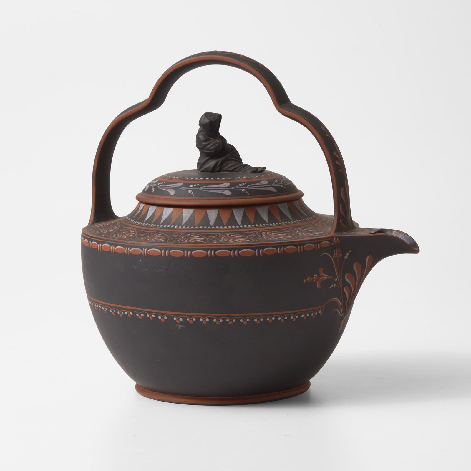 A Wedgwood An Encaustic-Decorated Black Baslates (Basalt) Rum Kettle UK, 1770s: A Wedgwood An Encaustic-Decorated Black Baslates (Basalt) Rum Kettle UK, 1770s Stoneware With Sibyl finial, Anthemion decoration at shoulder. Impressed "Wedgwood" (H: 8 5/8, W: 7, D: 9 in.) Qty: (1) <