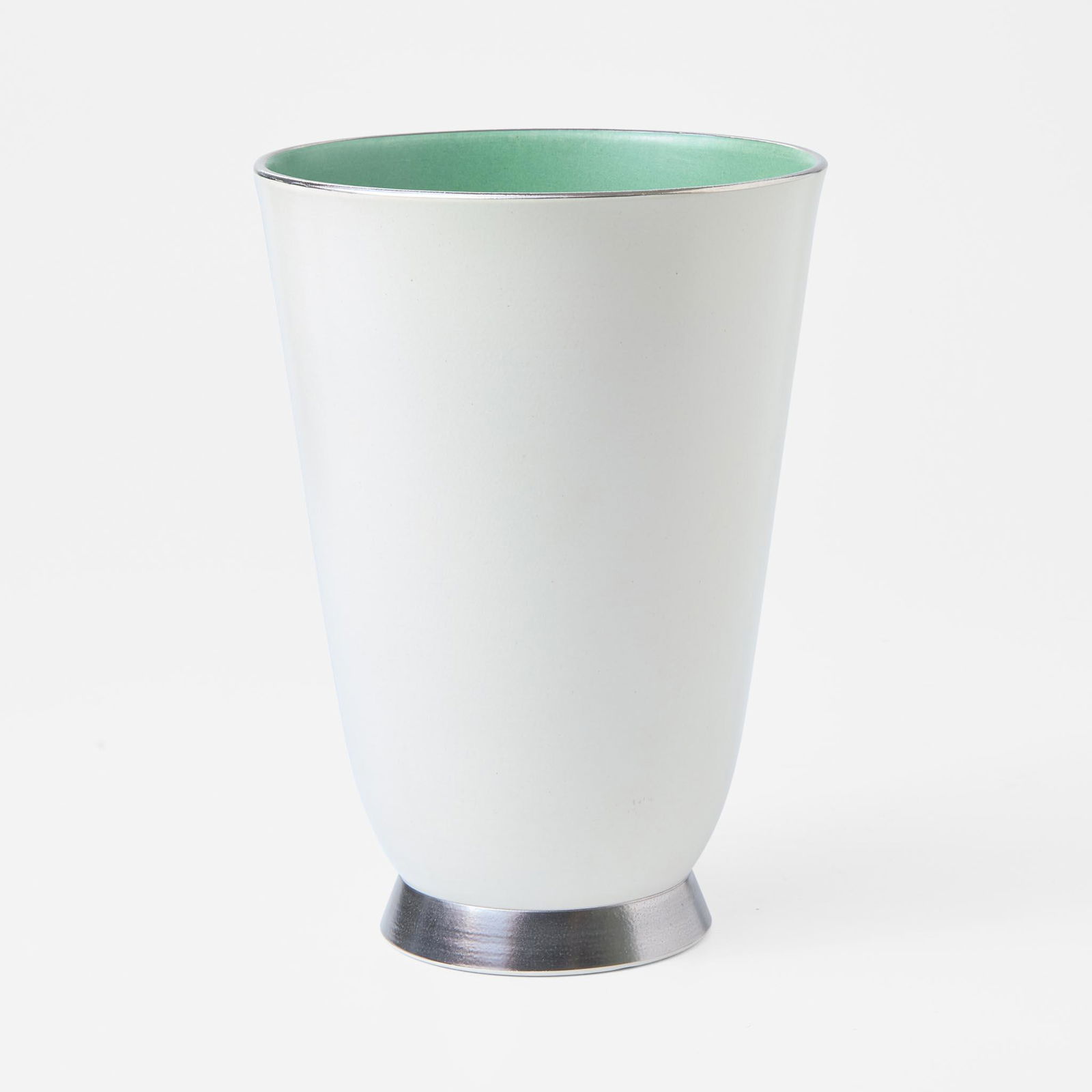 A Wedgwood Keith Murray (1892-1981) Designed Footed Vase UK, 1930s: A Wedgwood Keith Murray (1892-1981) Designed Footed Vase UK, 1930s Glazed earthenware.Moonstone-glazed exterior, matt green interior, platinum decoration.Impressed "WEDGWOOD" and "MADE IN ENGLAND". Pr