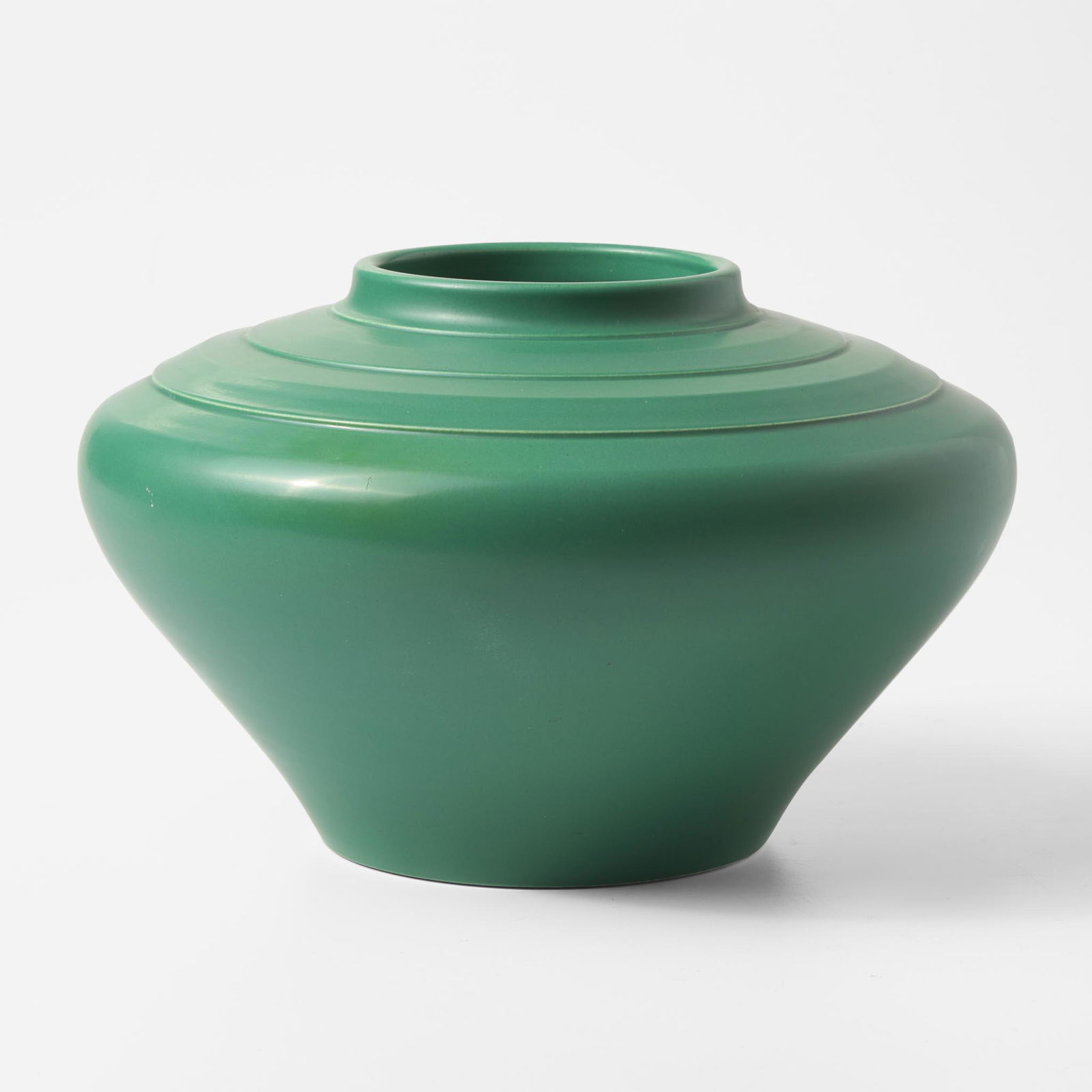 A Wedgwood Keith Murray (1892-1981) Designed Matt Green Vase UK, 1930s: A Wedgwood Keith Murray (1892-1981) Designed Matt Green Vase UK, 1930s Glazed earthenwarePrinted Keith Murray Wedgwood signature mark (H: 7, Dia: 10 7/8 in.)Qty: (1) Provenance<