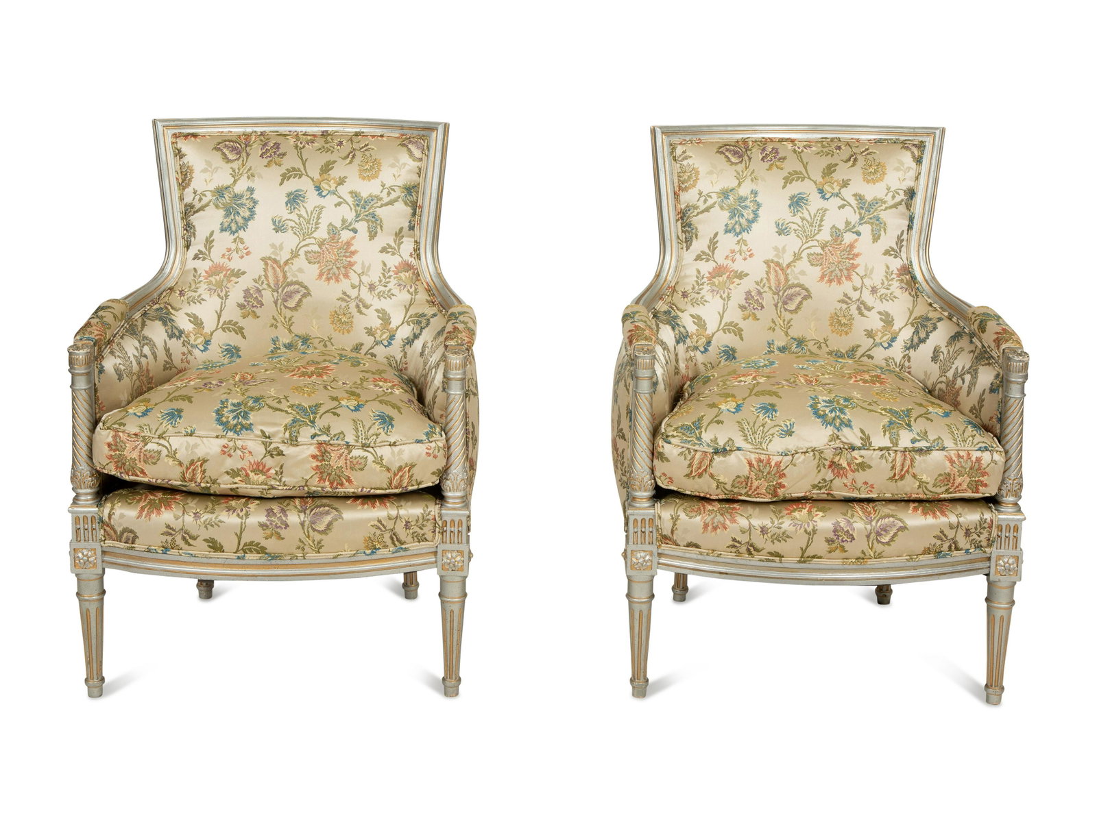 A Pair of Louis XVI Style Painted and Parcel Gilt Bergeres: A Pair of Louis XVI Style Painted and Parcel Gilt Bergeres 19th Century with silk upholstery.Height 36 x width 26 x depth 23 inches. This lot is located in Palm Beach. Property of a Palm Beach Collect