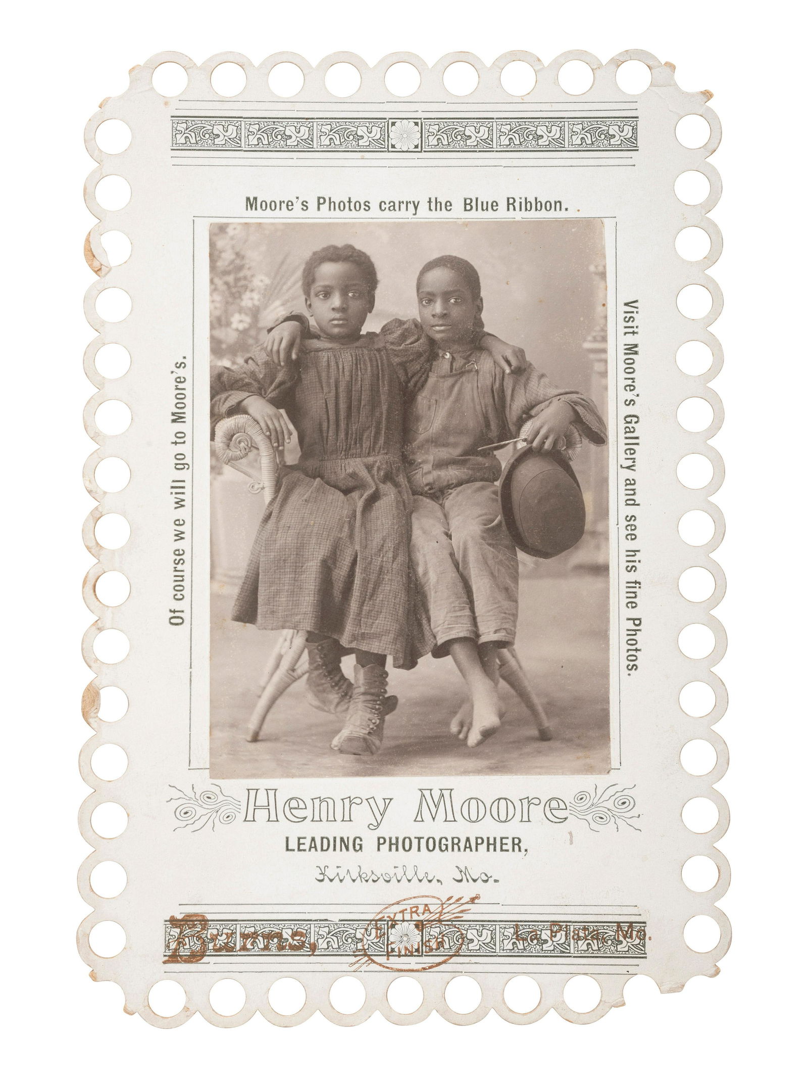 [EARLY PHOTOGRAPHY]. Advertising card for Henry Moore, Kirksville, MO, featuring two young African (1 of 2)