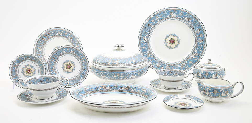 A Set of Wedgwood Dinnerware for Eight, Diameter o: A Set of Wedgwood Dinnerware for Eight, in the Florentine pattern, comprising dinner plates, luncheon plates, bread plates, finger bowls, cups with saucers, soups with saucers, a tureen, a creamer and