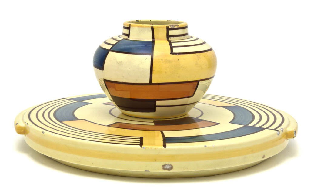 Two Schramberg Majolica Articles, Eva Zeisel, Diam: Two Schramberg Majolica Articles, Eva Zeisel, in the Mondrian pattern, comprising a vase of bulbous form and a circular handled tray, each bearing factory stamps, vase further marked 50 and impressed