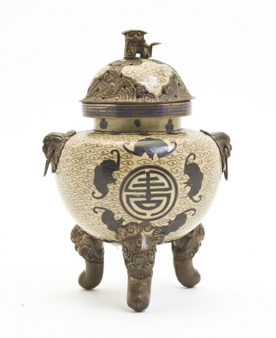 A Chinese Cloisonne Censer, Height 7 1/2 inches.: A Chinese Cloisonne Censer, having fu dog form finial, the body depicting swirling clouds upon a cream reserve decorated with five bats surrounding a shou medallion, with mask and ring handles raised 