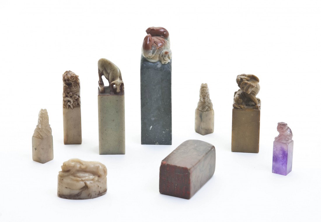 A Set of Nine Soapstone Chops, Height of tallest 4: A Set of Nine Soapstone Chops, one of which is amethyst. Height of tallest 4 inches.