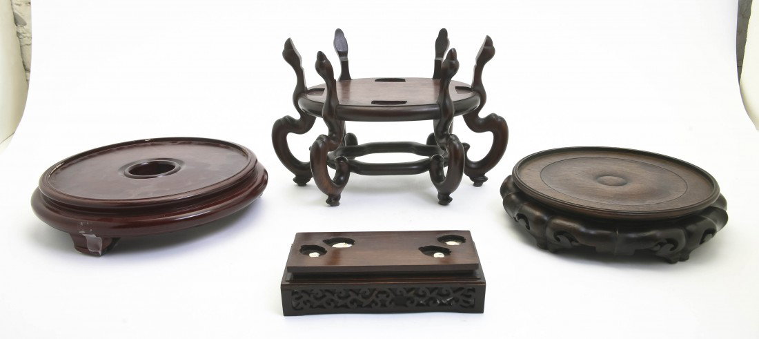 A Group of Five Chinese Carved Wood Stands, Diamet: A Group of Five Chinese Carved Wood Stands, of various forms and sizes. Diameter of largest 11 7/8 inches.