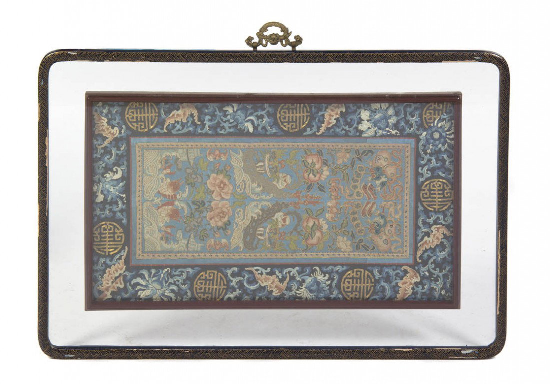 A Chinese Embroidered Sleeve Band, Height 26 1/2 x: A Chinese Embroidered Sleeve Band, with raised stitch over a blue reserve depicting various objects including shoes, bats, peaches and flowering vases, all above crashing waves with fish, framed. Heig
