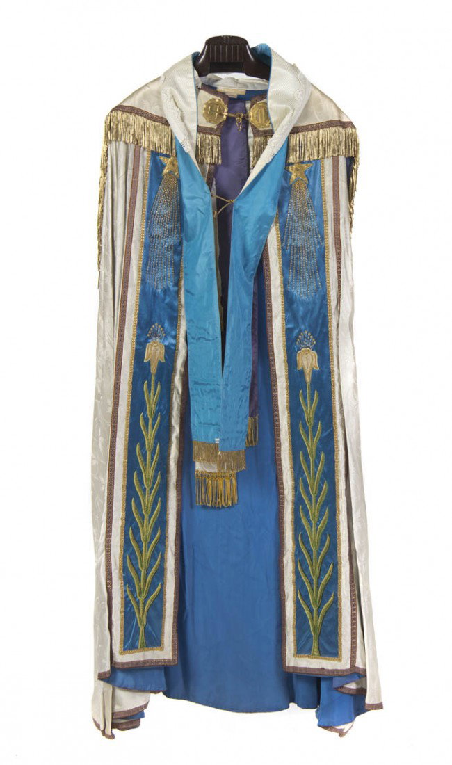 A French Ecclesiastical Embroidered Cope, Length o: A French Ecclesiastical Embroidered Cope, the reverse having an applied figure of the Madonna and two winged putto masks highlighted with silk embroidery against an ivory ground, the front with stars 