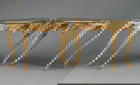 Pair of Venetian style painted and parcel gilt se: Pair of Venetian style painted and parcel gilt serpentine console tables The shaped veneered marble tops over pierced shell carved scroll friezes painted with floral sprays, raised on cabriole legs. W