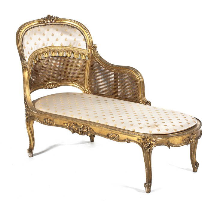 A Louis XV Style Giltwood Chaise, Length 56 1/2 inc: A Louis XV Style Giltwood Chaise, having a foliate carved crest over the caned back, arms and seat, raised on cabriole legs. Length 56 1/2 inches.