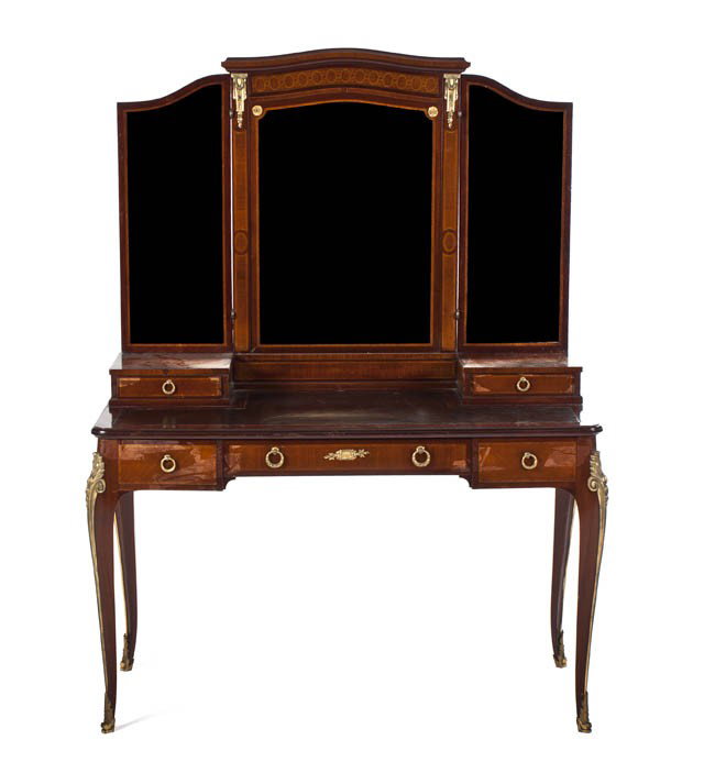 A Louis XVI Gilt Metal Mounted Dressing Table, Heig: A Louis XVI Gilt Metal Mounted Dressing Table, having a three-part mirror over two glove boxes above the leather inset top over three drawers, raised on cabriole legs ending in sabots. Height 63 1/2 x