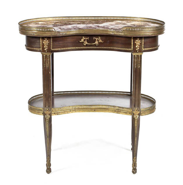 A Louis XVI Style Gilt Metal Mounted Mahogany Side: A Louis XVI Style Gilt Metal Mounted Mahogany Side Table, having a three-quarter galleried reniform marble top over a single drawer, raised on fluted tapering legs joined by a medial shelf. Height 30 