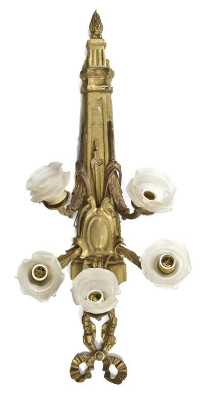 A Louis XVI Style Gilt Bronze Five-Light Sconce, H: A Louis XVI Style Gilt Bronze Five-Light Sconce, having a shield applied torch form backplate under the ribbon-tied finial issuing the five candle arms ending in frosted floriform diffusers. Height 40