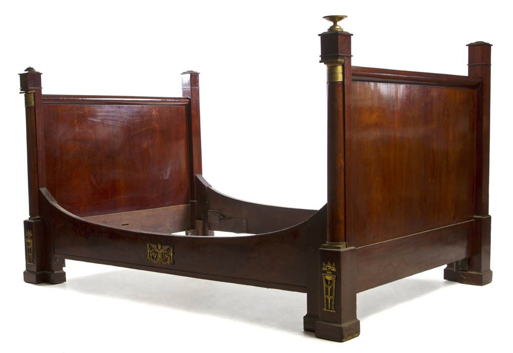 An Empire Mahogany and Gilt Metal Mounted Daybed, : An Empire Mahogany and Gilt Metal Mounted Daybed, having urn form finials over the applied gilt metal mounts. Height 49 3/4 x width 55 inches.