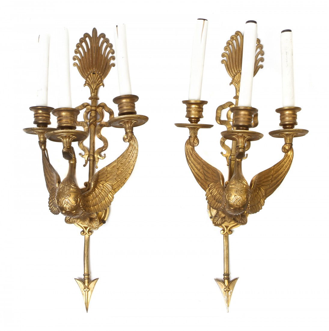 A Pair of Empire Style Gilt Bronze Three-Light Sco: A Pair of Empire Style Gilt Bronze Three-Light Sconces, having ribbon-tied arrow backplate with swan form support issuing candle arms of wing tips and head. Height 20 1/2 inches.